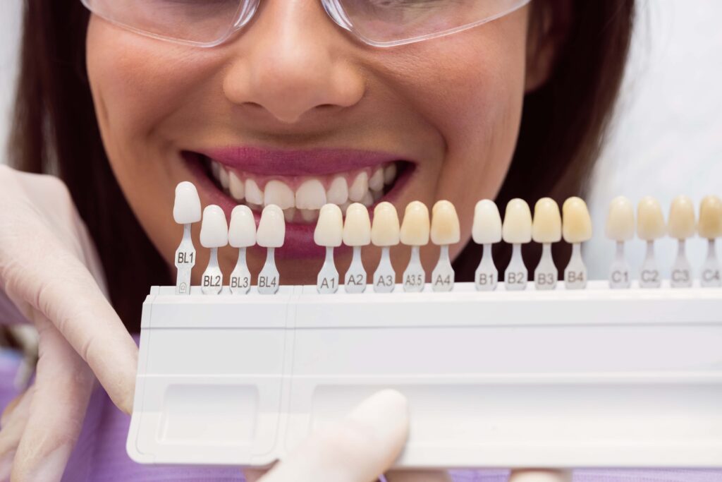 11dentist-examining-female-patient-with-teeth-shades